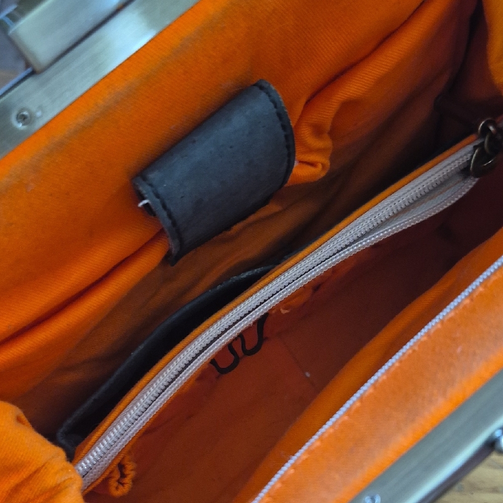 Vibrant Orange and Black Backpack with Organized Interior